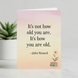 jules renard birthday quote set against a simple background with a small illustration of a stack of books and a flower