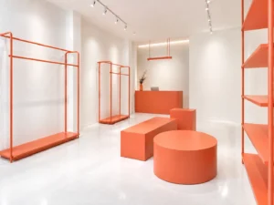 A fashion boutique with coral colored fixtures and fittings