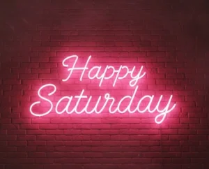 Neon light that says Happy Saturday