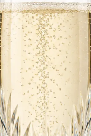 A close up of champagne in an elegant crystal glass