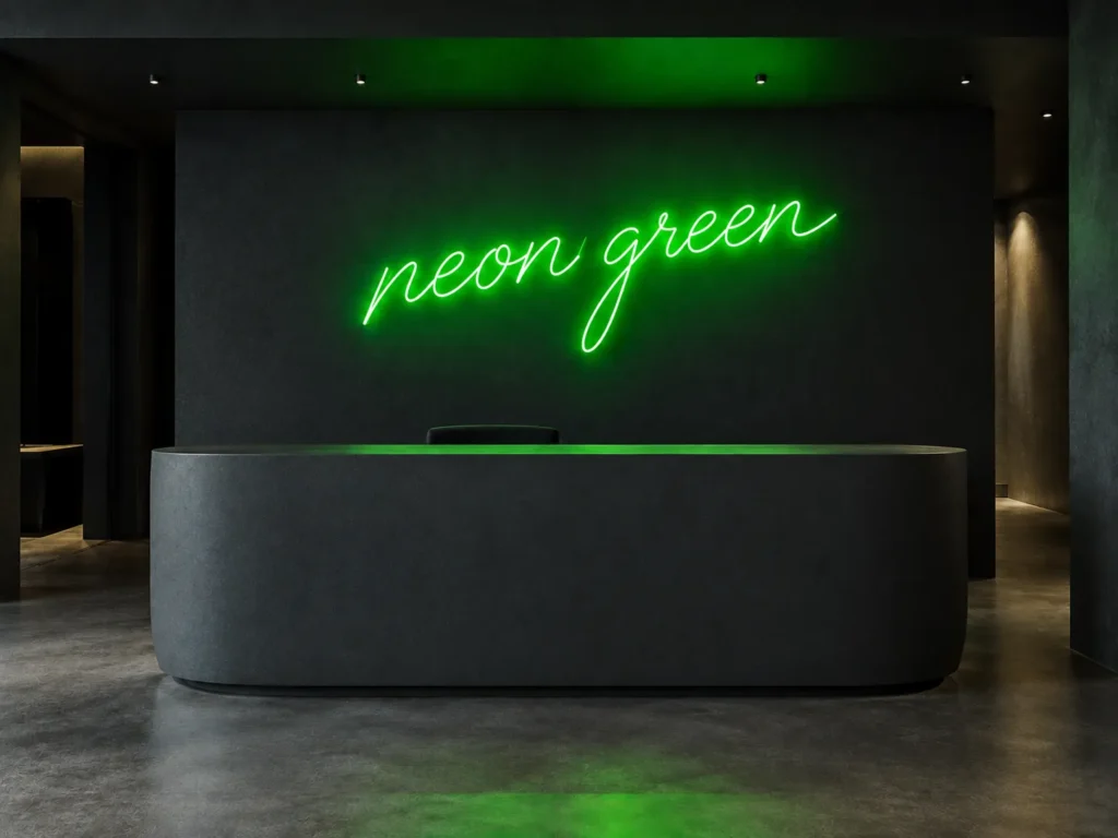 A contemporary reception area with a color scheme of dark neutrals and neo green as an accent color
